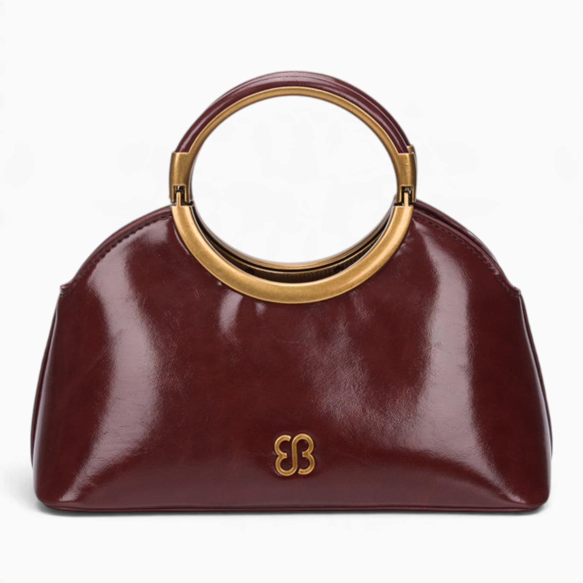 Wine ring handle crossbody bag with a gold ring handle and rounded shape