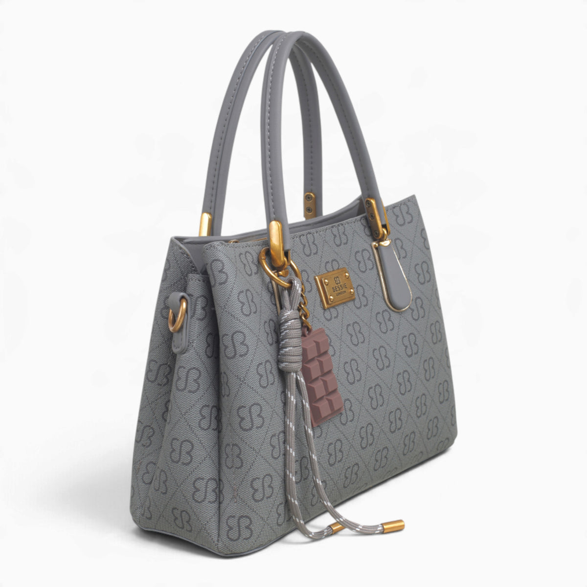 Grey small monogram tote bag, angled view showing the monogram print and charm