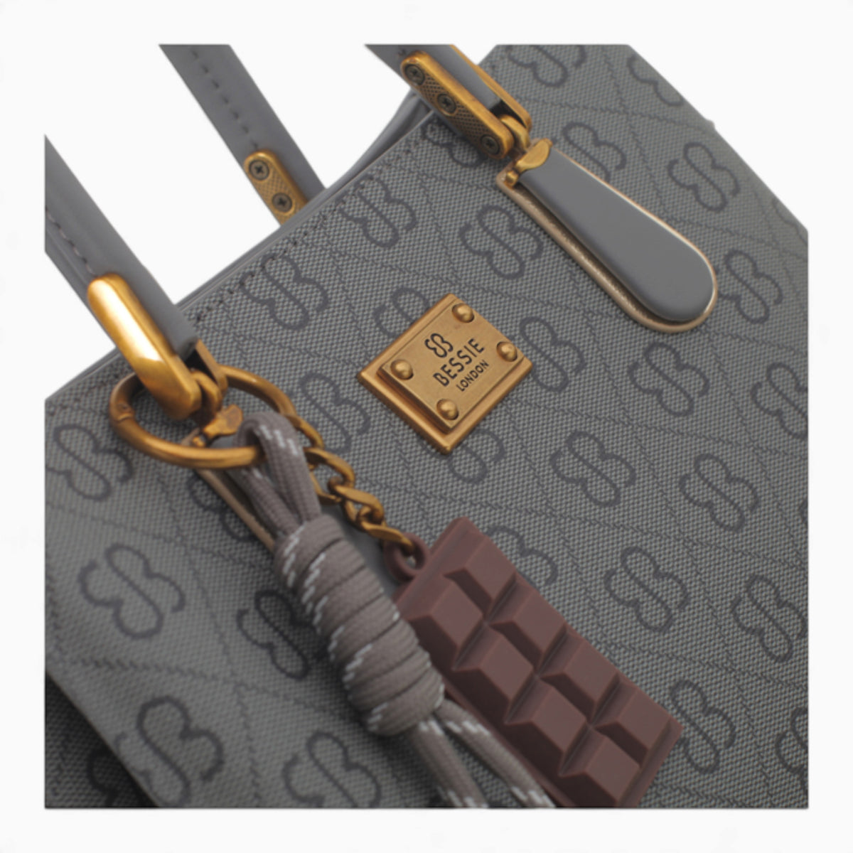 Grey small monogram tote bag, close-up of the charm and monogram print
