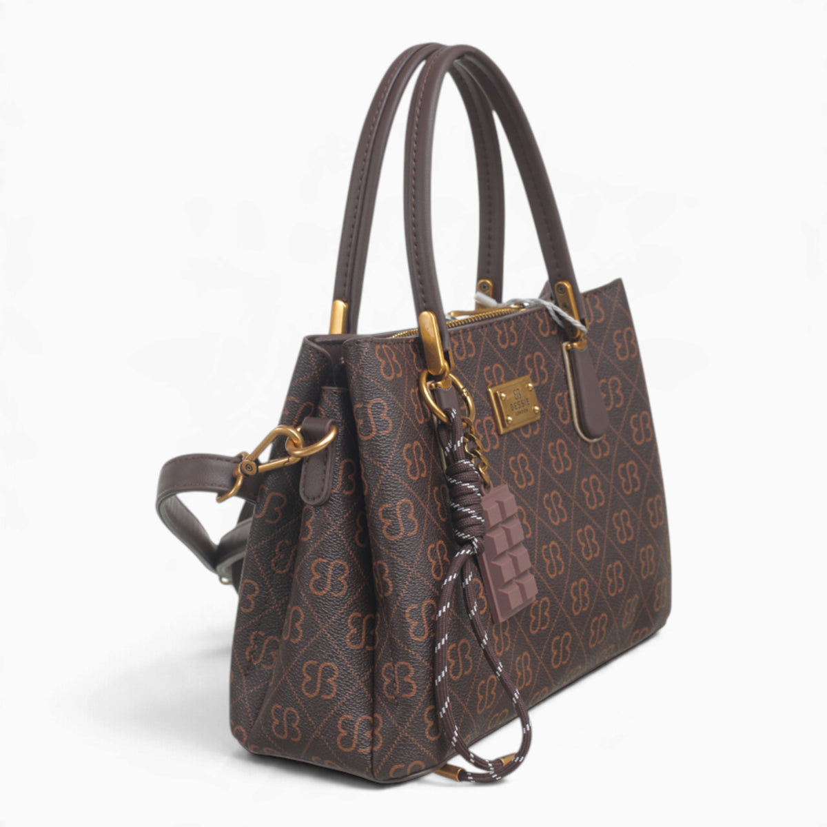 Coffee small monogram tote bag, angled view showing the monogram print and charm