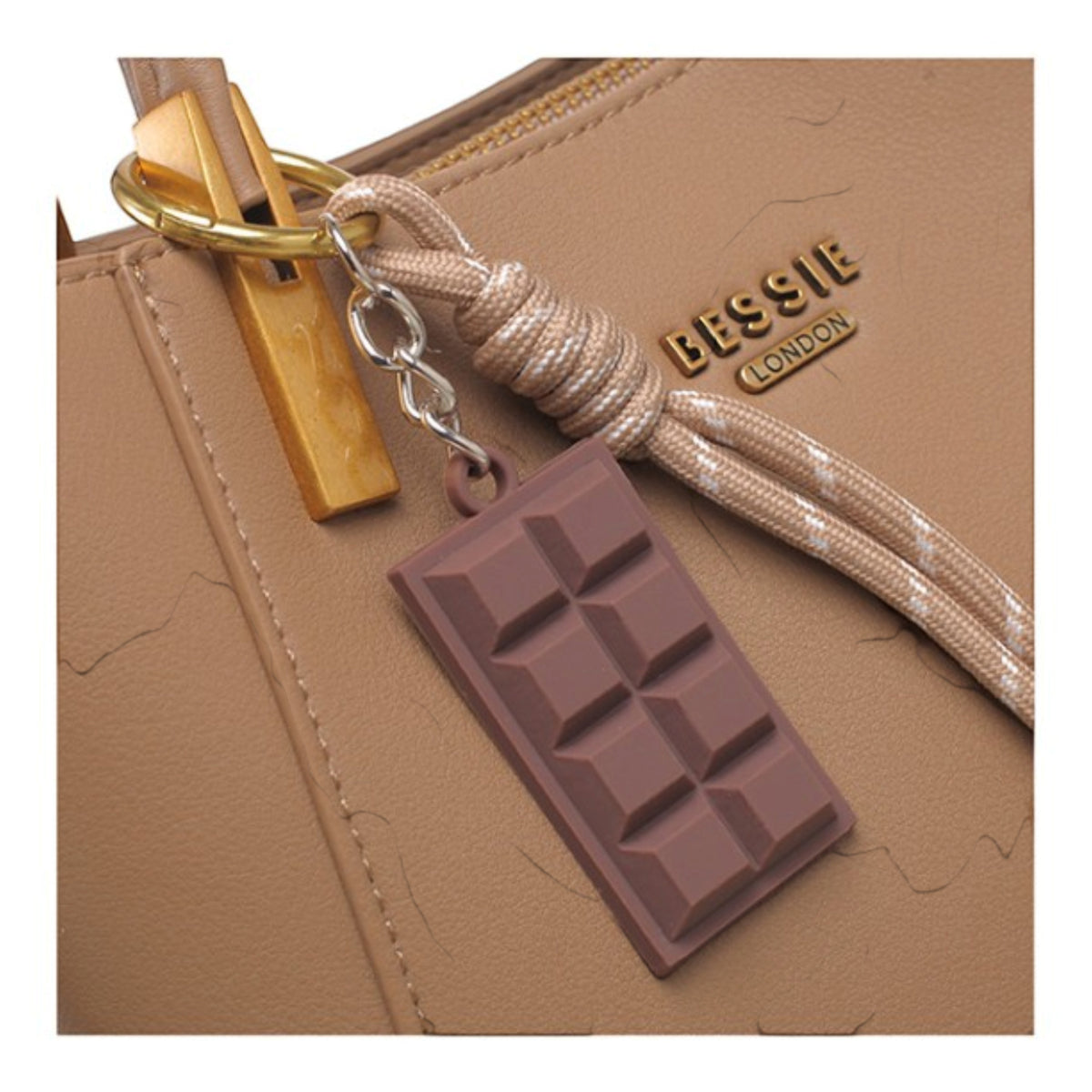 Taupe faux leather tote bag, close-up of the chocolate bar charm