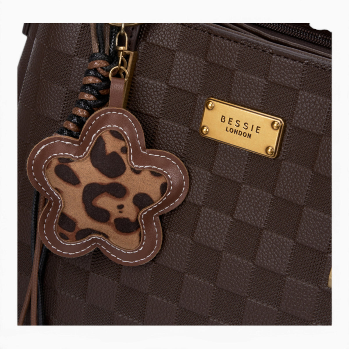 Coffee checkerboard tote bag, close-up of the checkerboard pattern and charm