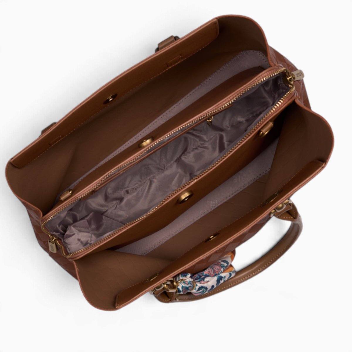 Tan monogram tote bag opened to show the three compartments with a middle zip
