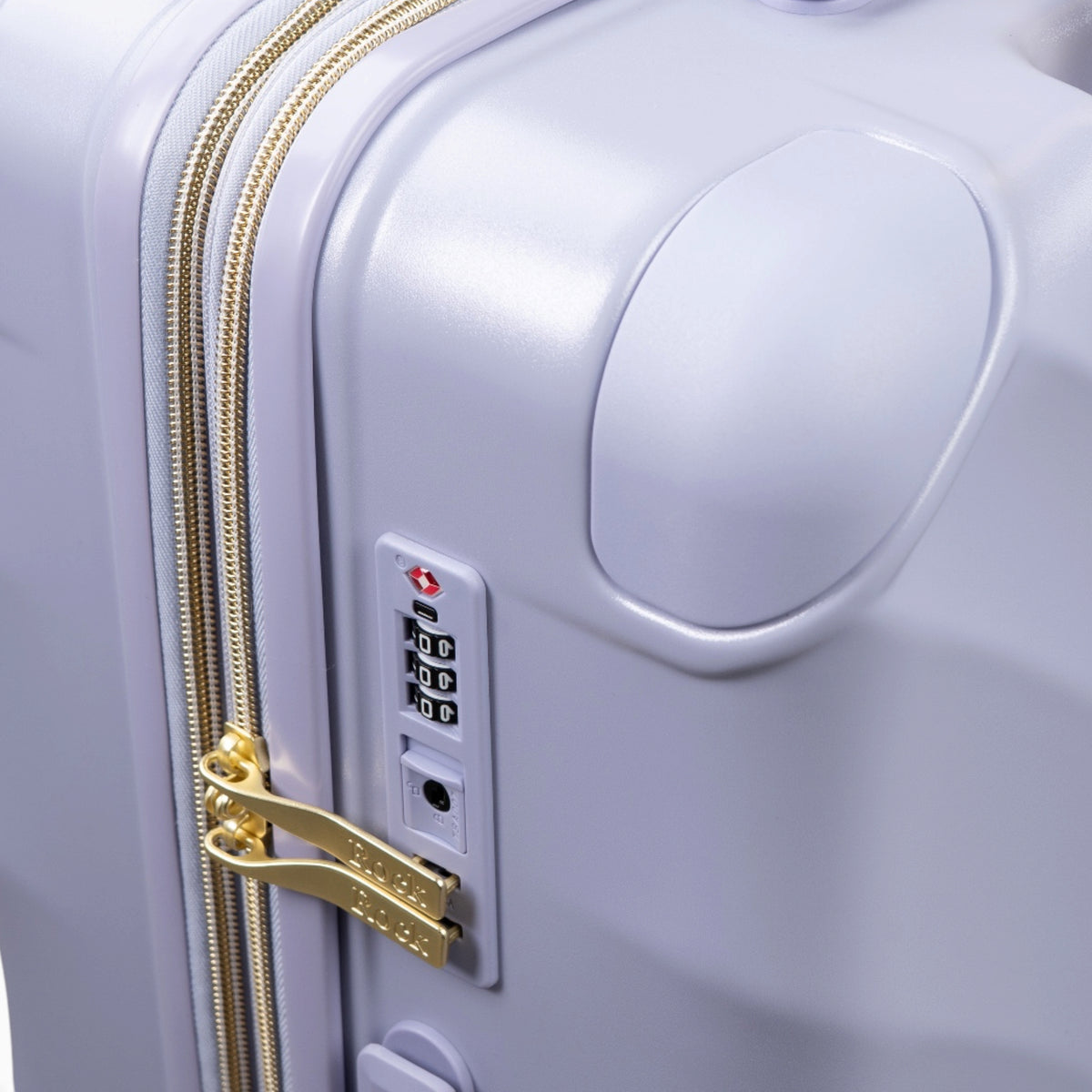 Lilac Sunrise Sahara suitcase, close-up of the TSA combination lock