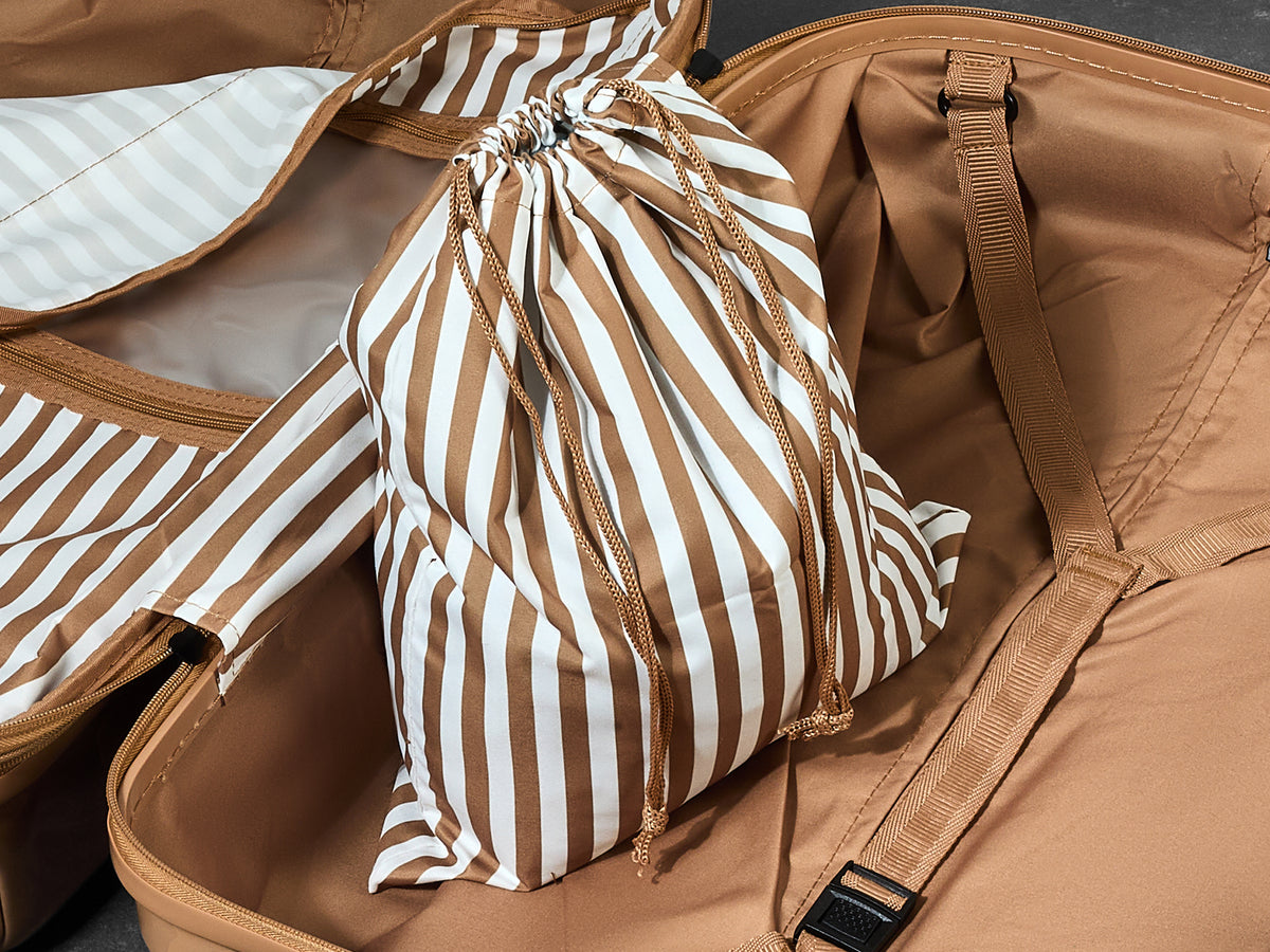 Chocolate Gelato suitcase, close-up of the matching striped laundry bag inside