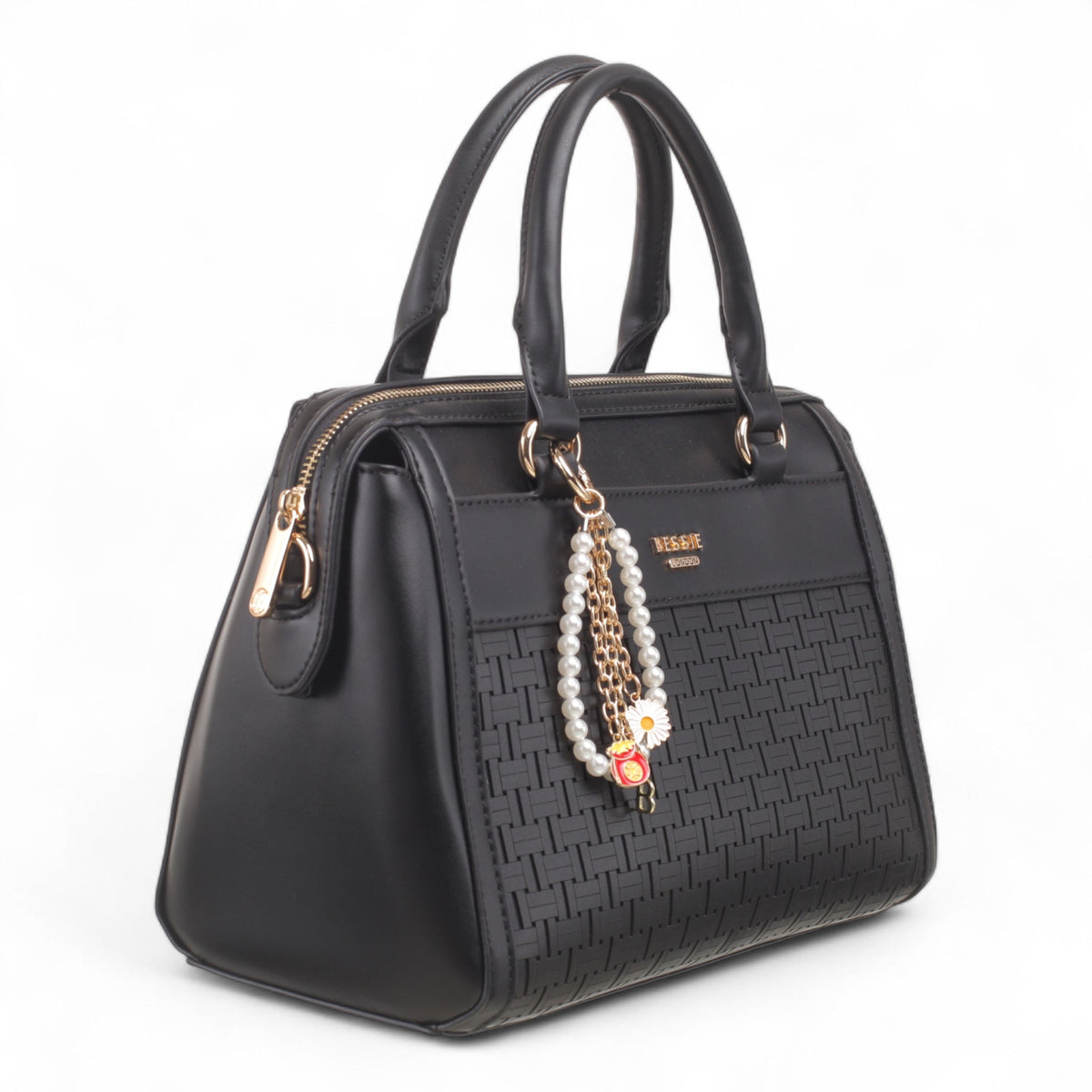 Bag Shack black faux leather handbag with woven front panel, gold hardware, and decorative pearl and flower charm.