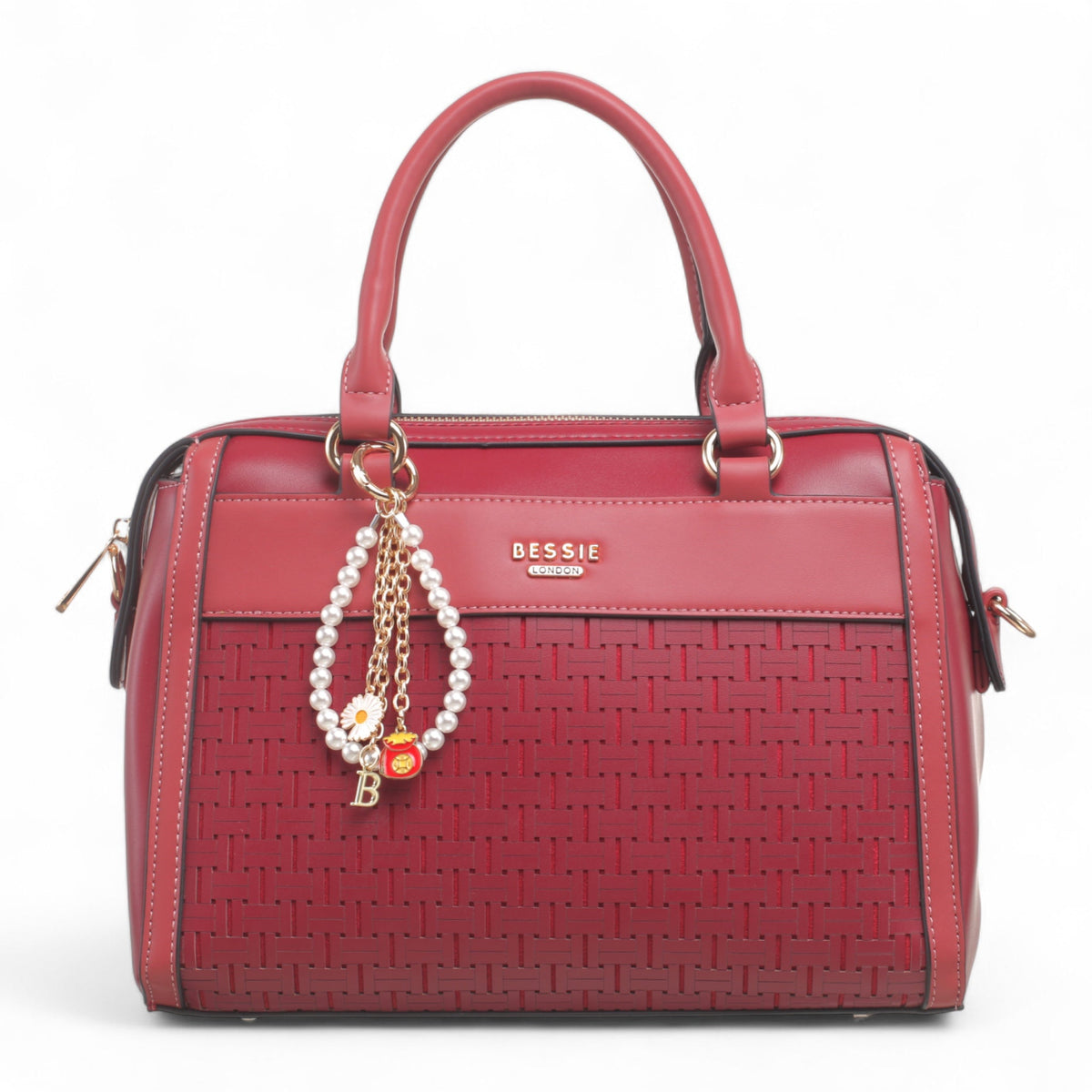 Bag Shack Bessie wine red faux leather handbag with a woven front panel, gold hardware, and a pearl charm accessory.