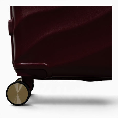 Burgundy Dusk Sahara suitcase, close-up of the 8 double spinner wheels