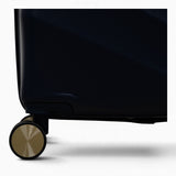 Midnight Navy Sahara suitcase, close-up of the 8 double spinner wheels