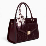 Wine velvet-effect flap tote bag, angled view showing the flap top and scarf