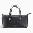 Black minimalist tote bag with a scarf tied to the handle