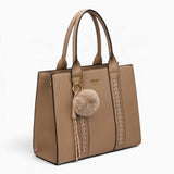 Taupe pebble textured tote bag, angled view showing the pebble texture and charm
