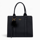 Black pebble textured tote bag with a pom-pom charm