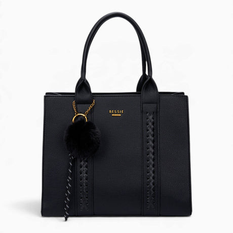 Black pebble textured tote bag with a pom-pom charm