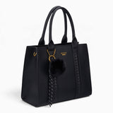 Black pebble textured tote bag, angled view showing the pebble texture and charm