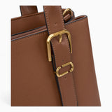 Tan minimalist everyday tote bag, close-up of the side buckle detail