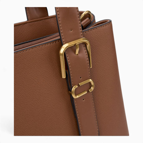 Tan minimalist everyday tote bag, close-up of the side buckle detail