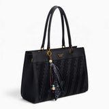 Black woven wave panel shoulder bag, angled view showing the woven wave panel and scarf