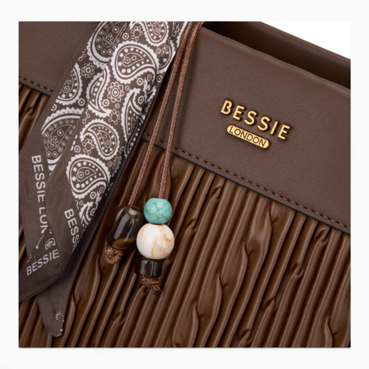 Coffee woven wave panel shoulder bag, close-up of the woven wave panel and charm