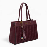 Wine woven wave panel shoulder bag, angled view showing the woven wave panel and scarf