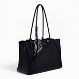 Black knot handle shoulder bag, angled view showing the knot handle detail