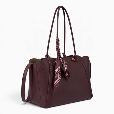 Wine knot handle shoulder bag, angled view showing the knot handle detail