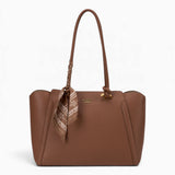 Tan knot handle shoulder bag with a scarf accent