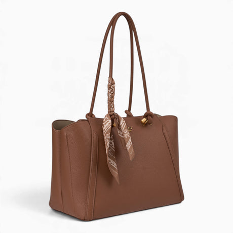 Tan knot handle shoulder bag, angled view showing the knot handle detail