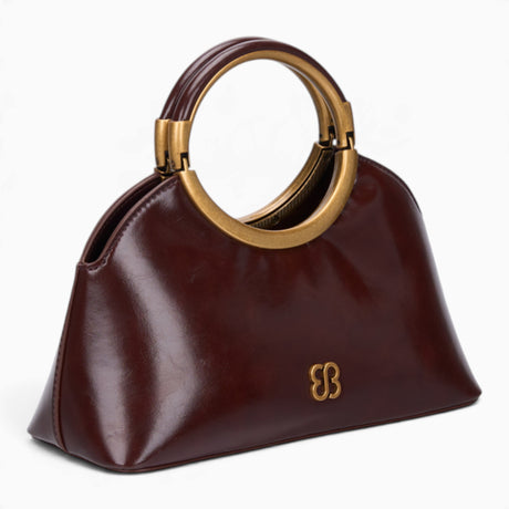 Coffee ring handle crossbody bag, angled view showing the sculptural ring handle