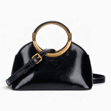 Black ring handle crossbody bag with its detachable crossbody strap attached