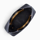 Black ring handle crossbody bag opened to show the fully lined interior and zip closure