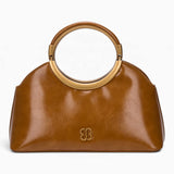 Tan ring handle crossbody bag with a gold ring handle and rounded shape