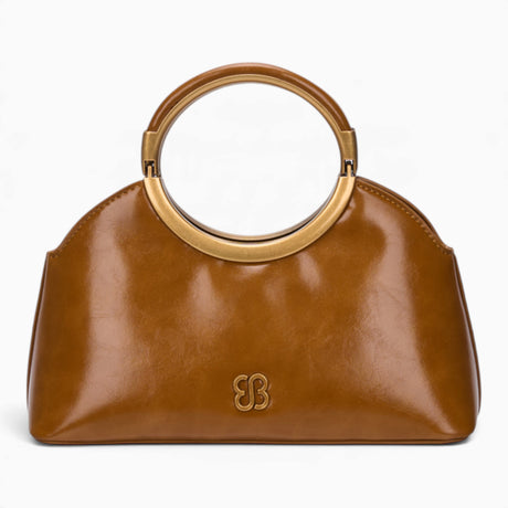 Tan ring handle crossbody bag with a gold ring handle and rounded shape