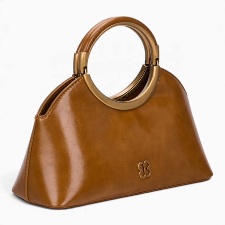 Tan ring handle crossbody bag, angled view showing the sculptural ring handle