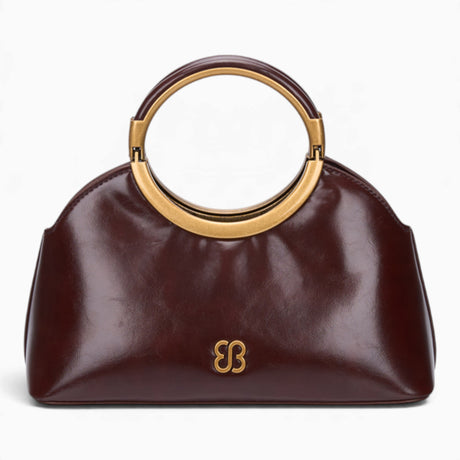 Coffee ring handle crossbody bag with a gold ring handle and rounded shape