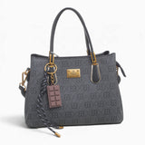 Black small monogram tote bag with a charm and double handles