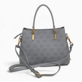Grey small monogram tote bag with its detachable shoulder strap attached