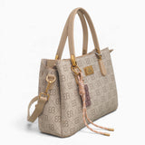 Khaki small monogram tote bag, angled view showing the monogram print and charm