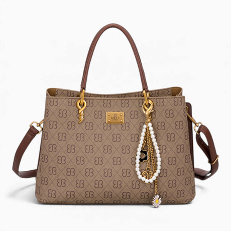 Tan monogram grab bag with a bag charm and double handles