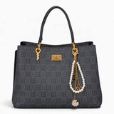 Black monogram grab bag with a bag charm and double handles