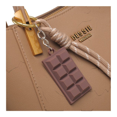Taupe faux leather tote bag, close-up of the chocolate bar charm