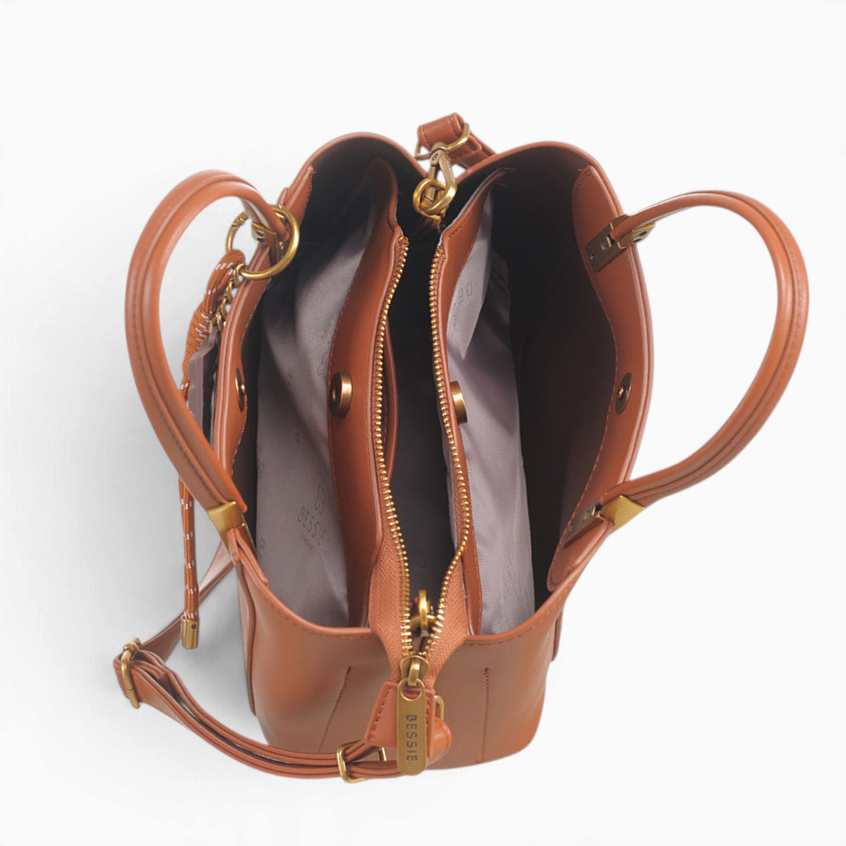Tan faux leather tote bag opened to show the middle compartment with zip and magnetic dots