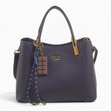 Purple faux leather tote bag with a chocolate bar charm