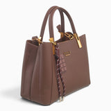 Coffee faux leather tote bag, angled view showing the structured shape and charm