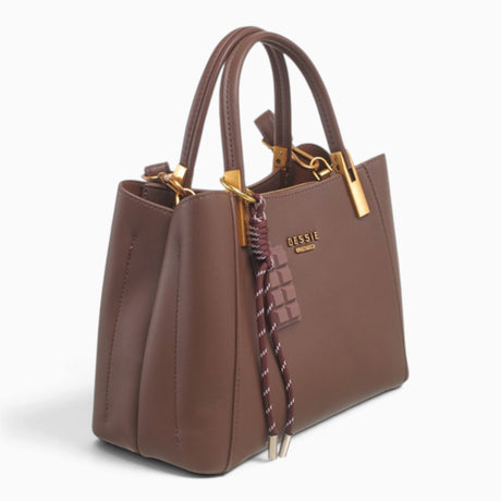 Coffee faux leather tote bag, angled view showing the structured shape and charm