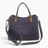 Purple faux leather tote bag with its detachable shoulder strap attached