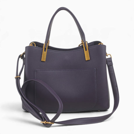 Purple faux leather tote bag with its detachable shoulder strap attached