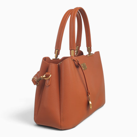 Tan structured tote bag, angled view showing the structured shape and charm