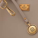 Bag Shack | Luggage, Bags, Handbags & Travel Accessories beige pebbled leather handbag with gold hardware and logo tag