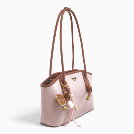 Pink knot shoulder bag, angled view showing the knotted straps